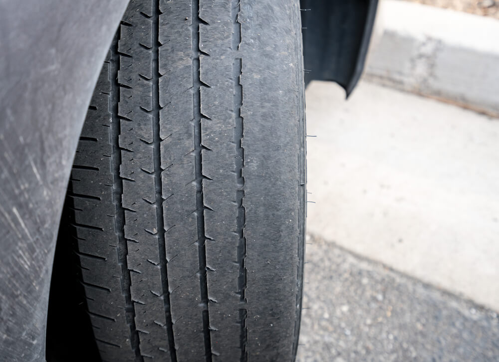 bald tire driving in the rain