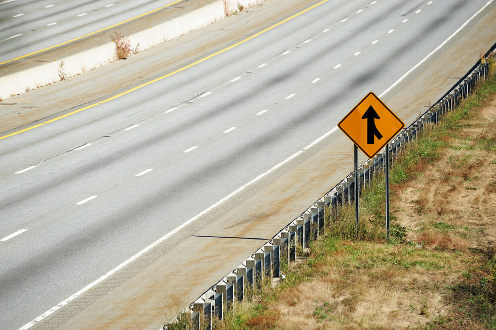 a merging traffic sign warns you